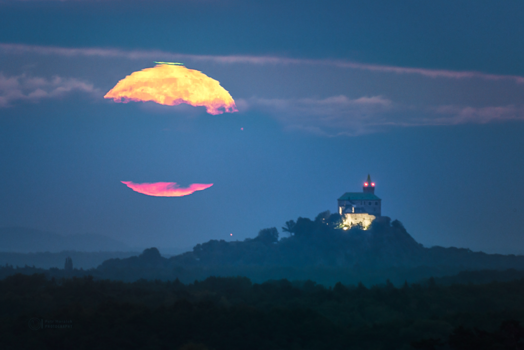 Green flashing Moon over Castle
